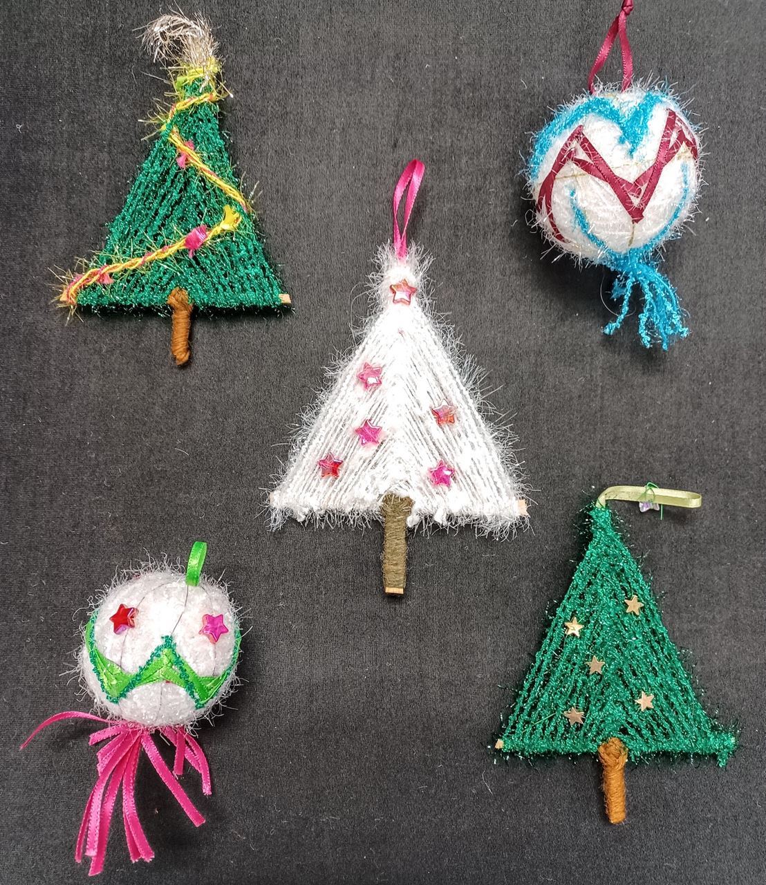 Five examples of Holiday Ornaments with Wendy Arbeit. three decorative trees and two embellished round ornaments. 